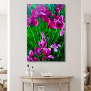 Iris by Anju Desai. A vibrant painting of iris flowers with shades of green created using finger painting. No brush was used for the background, giving it a natural and flowy look. The luminous shade of the flowers was achieved through a unique combination of colors.