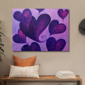 Painting titled 'Floating Heart,' created using purple shades that were originally unused. The artwork features a freehand design with a purple background, reflecting the artist's spontaneous approach. The floating heart motif emerged from an intuitive creative process.