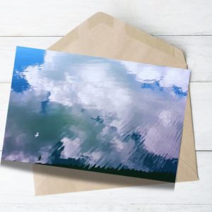 white clouds reflecting on the water a white bird showing freedom sprit joy