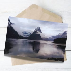 Milford Sound view with clouds, deep blue colours photograph in winter.