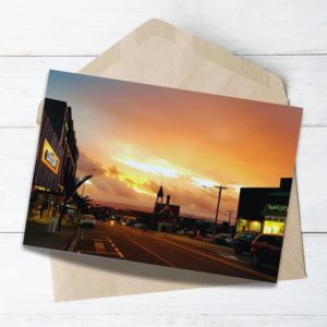 Bright and colourful sunset over Ponsonby Road in Auckland, captured from the street with glowing skies and urban charm