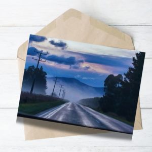 southland south isalnd landscape long road with fog blue mountain and green trees. Winter sunrise.