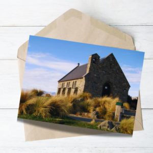 beautiful church in nz at lake tekapo with lush grass.