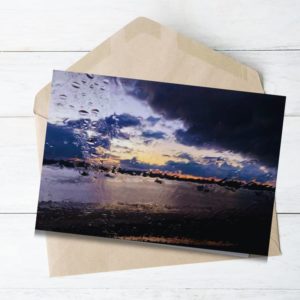 New Zealand landscape abstracted image with raindrops shade of blue and sunset.