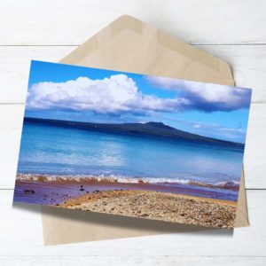 Blue ocean blue sky white cloud and rangitoto island in the background Auckland north shore.